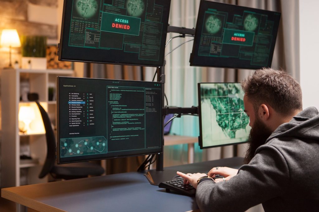 Bearded cyber terrorist gets access while typing a virus